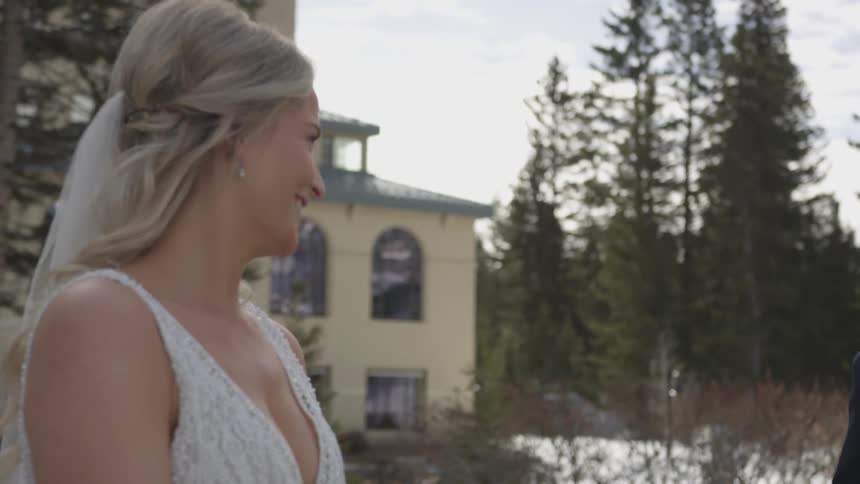 A woman smiles outside
