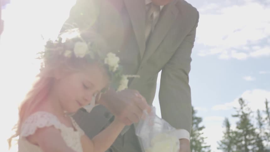 A child walk with the bride with a crown on her head