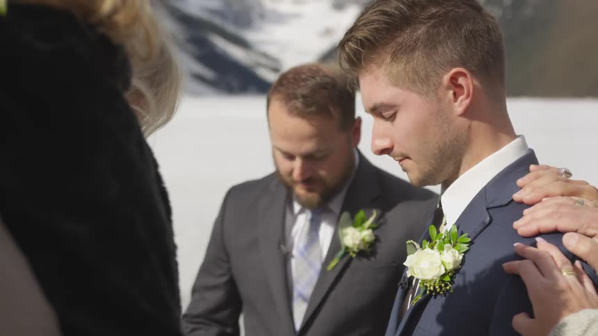 A group of a man with suit at snowy mountain