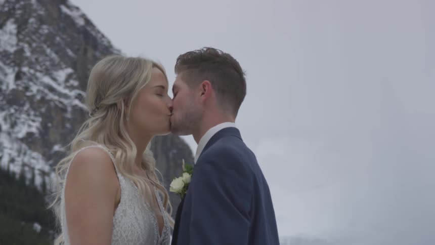 Husband and wife are kissing on their wedding day