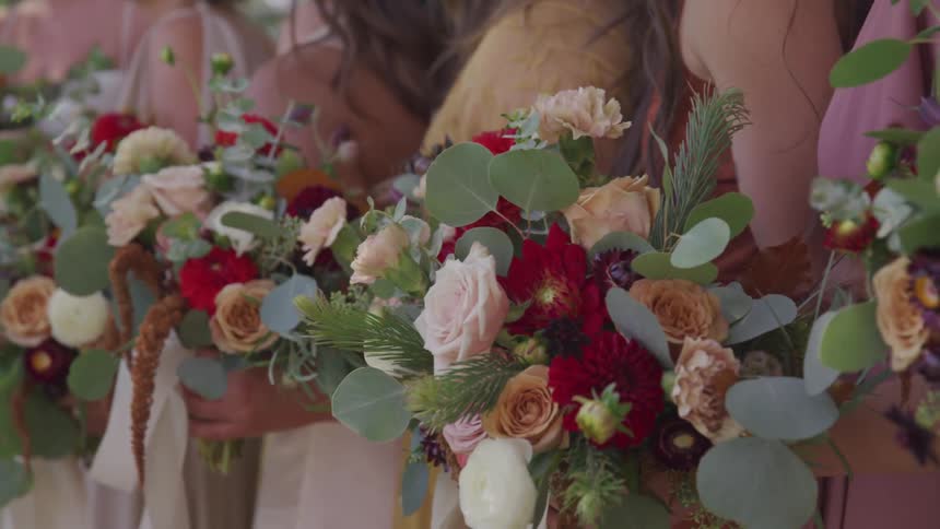 A bunch of girl walks with flower bouquet