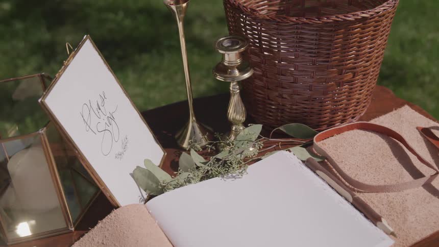 A guest book sits on a table outside