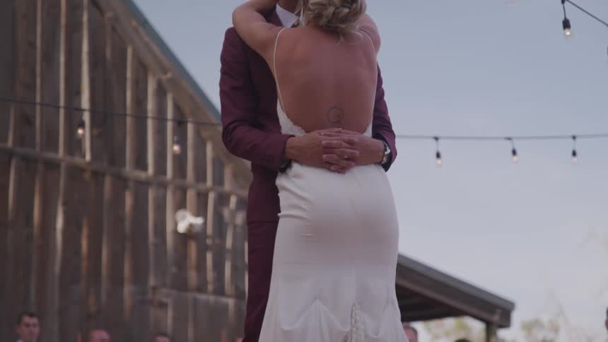 Groom and bride dance in front of the guests during the wedding ceremony