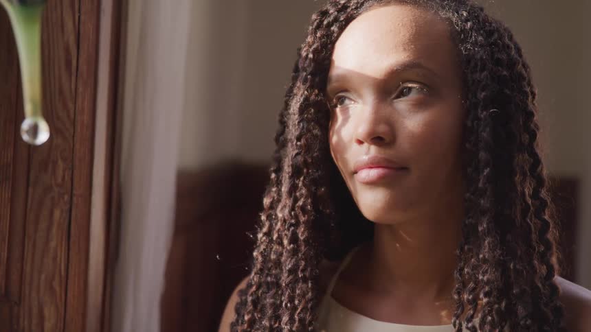 A woman is in a room looking around