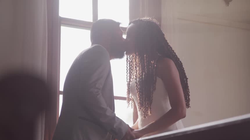 Couple kissing at the room