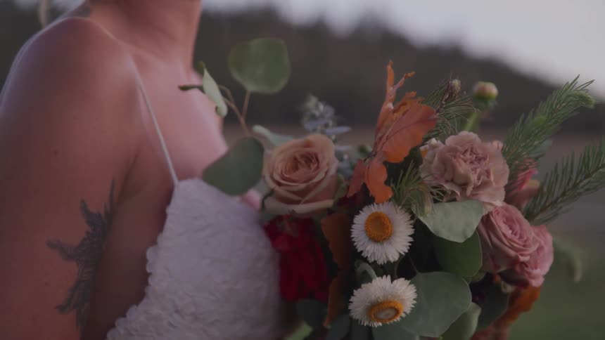 A bride holding a flower bouquet