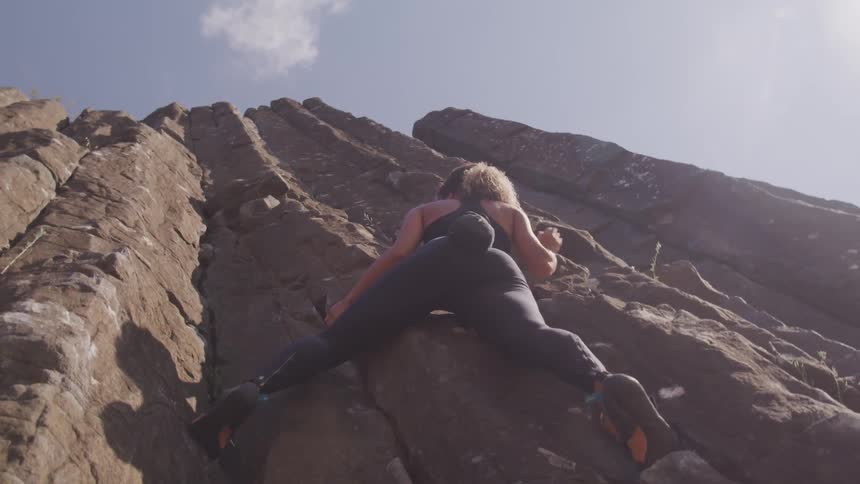 A woman doing a rock climbing