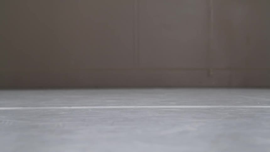 Little ballerina performs ballet in a ballet studio
