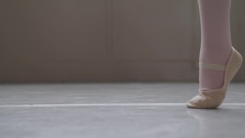 Ballerina legs twirling on the floor