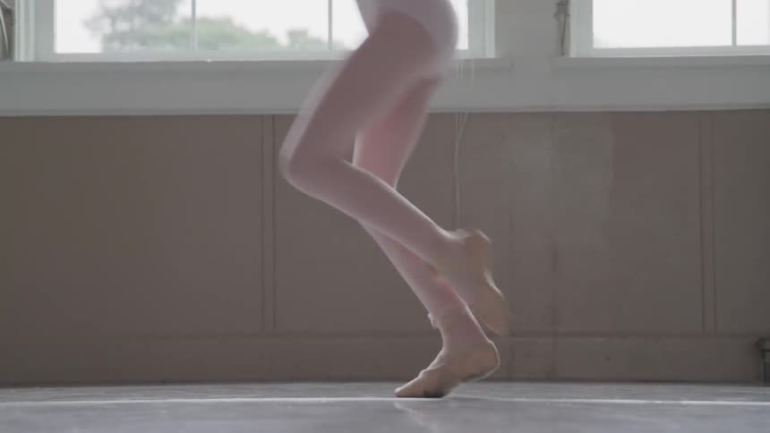 A child doing ballet at the classroom
