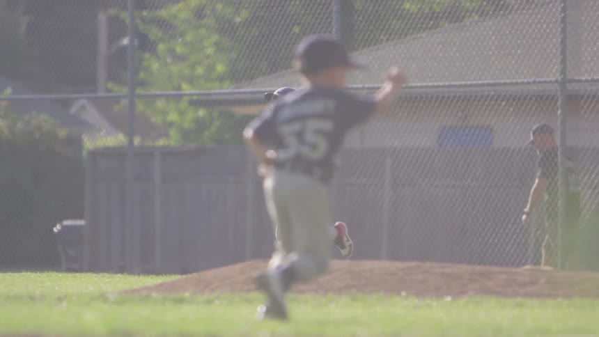 Little boys running and play baseball