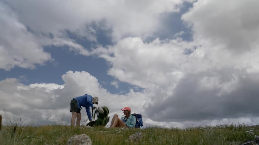 A couple resting on a grass field