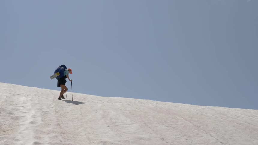 A man hiking at the snowy mountain