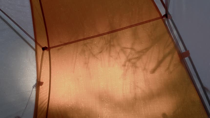Water droplets sit on top of a tent