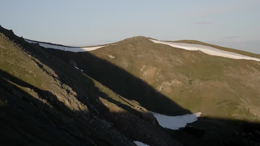 A view of a grassy mountain