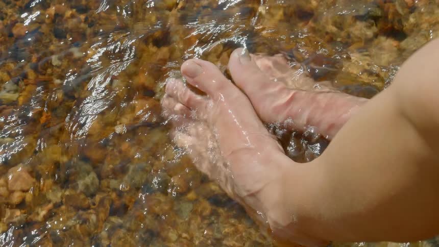 A feet on a river water