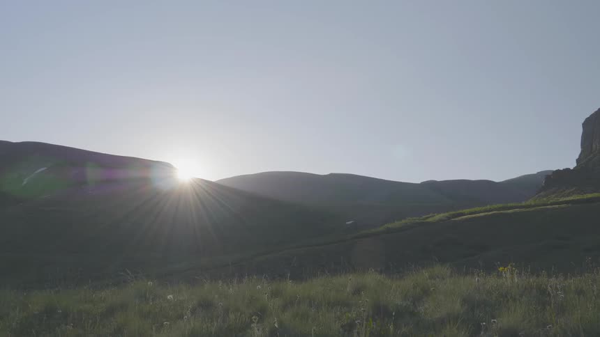 Sun goes down behind the mountain range