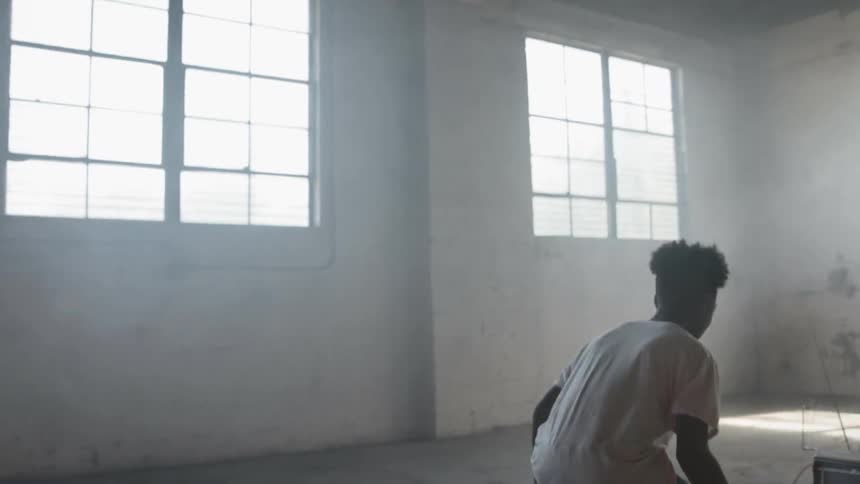 A black teenager train on the room