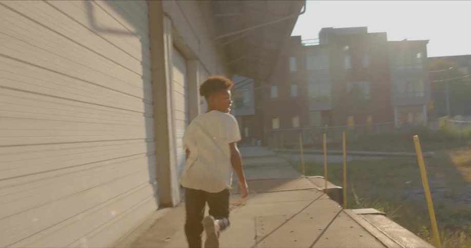 A black teenager running