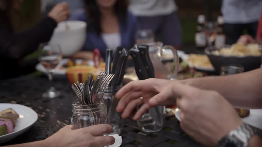 People are sitting at a table eating