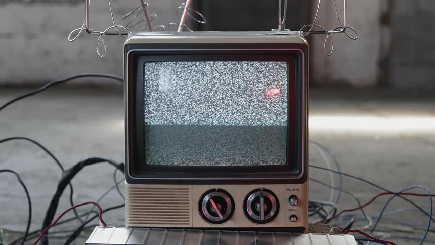 An old tv showing a static screen