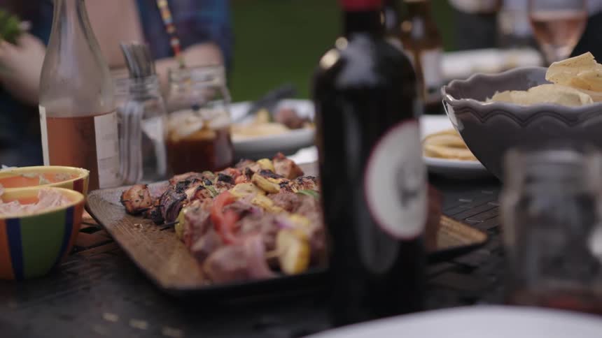 Group of people eating barbecue