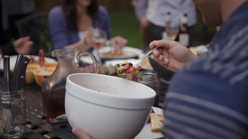 People are sitting at a table eating