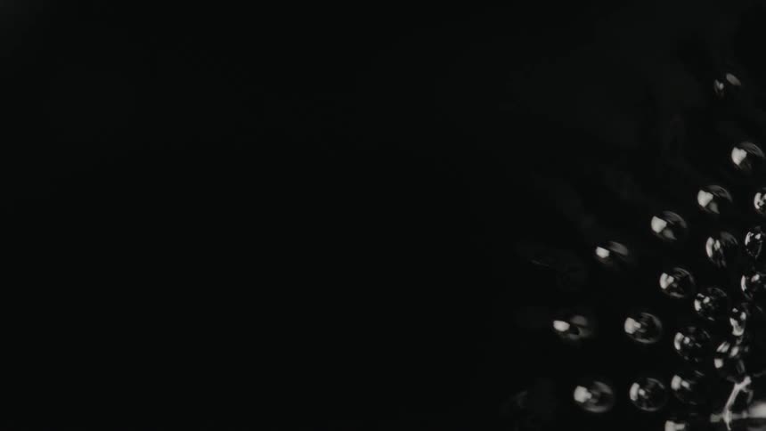 Droplets form in a dark liquid