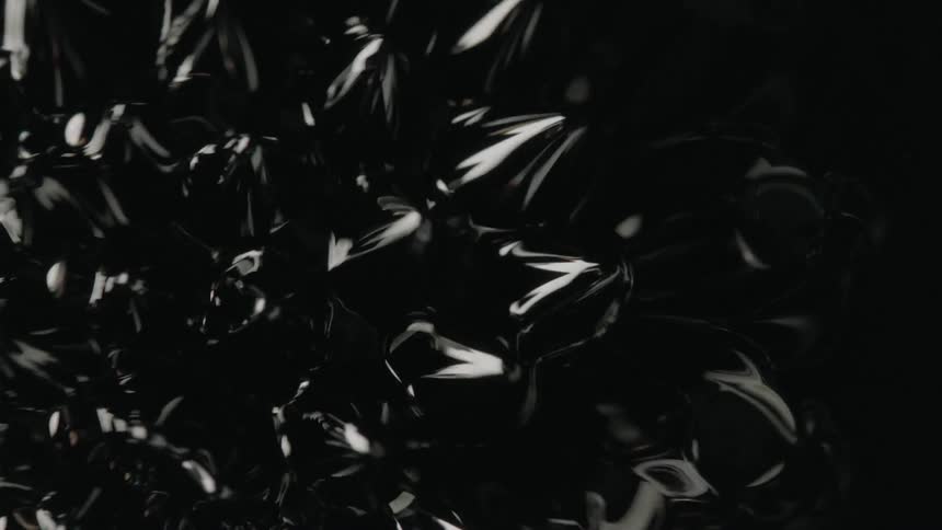 Vibrations causes bubbles and peaks in black liquid