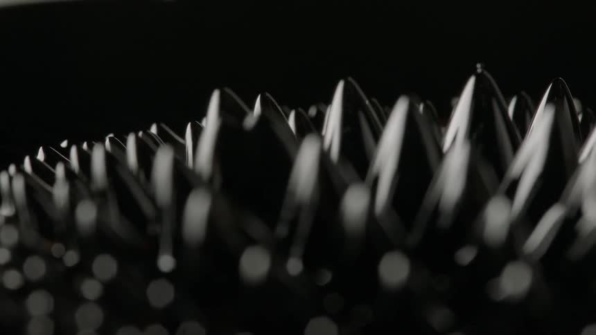 A ferrofluid moves in the darkness