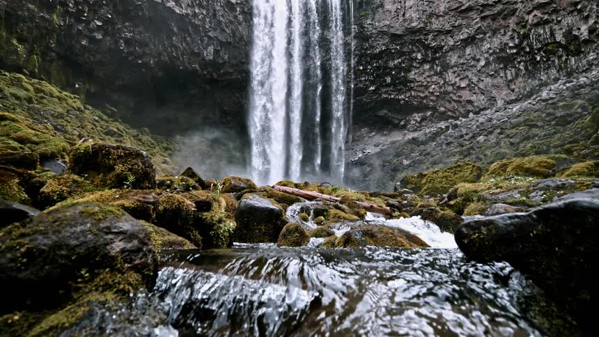 A scenery of beautiful waterfall and river