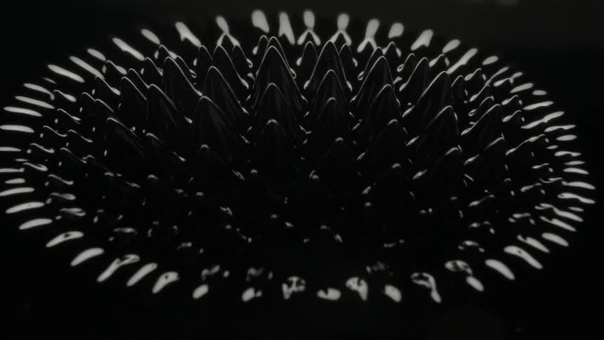 Light reflection and vibration create peaks and designs in black
