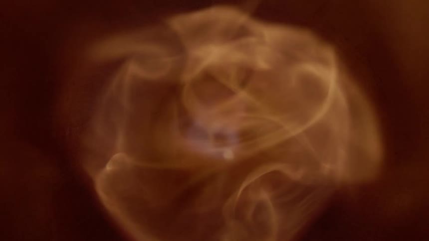 Flames rise up through a pipe then go out