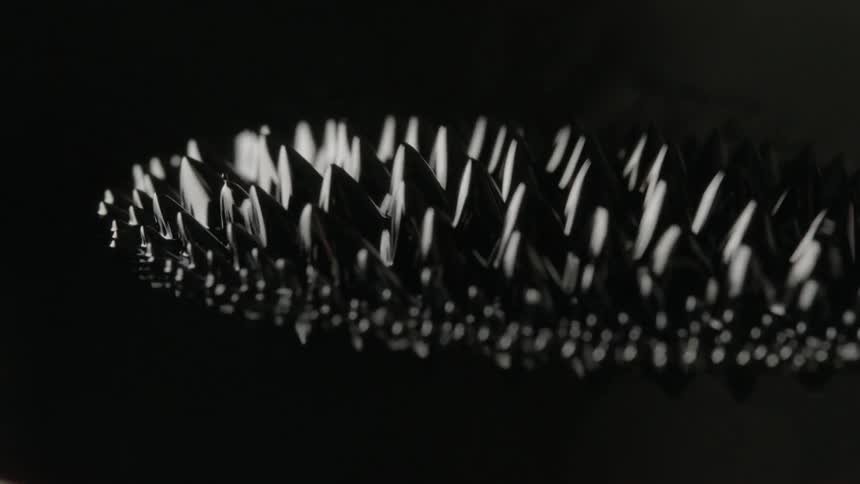 Light reflection and vibration create patterns and designs in black