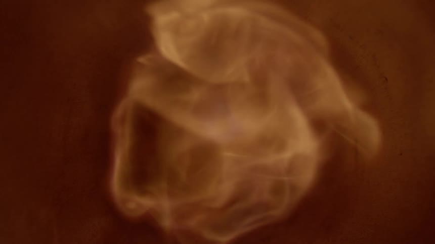 Flames and gas traveling towards the camera through a pipe