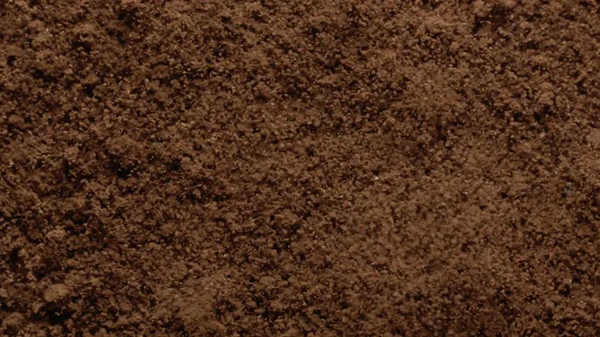 Brown material vibrating on a surface