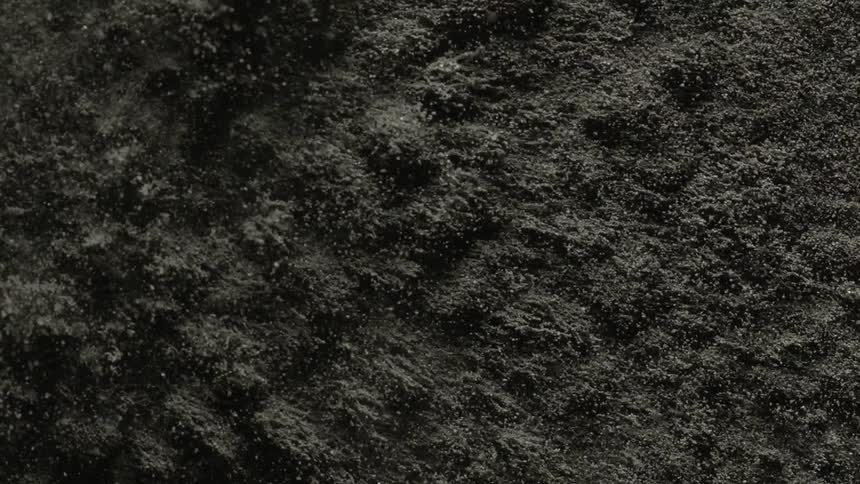 A footage of a shaking black sand
