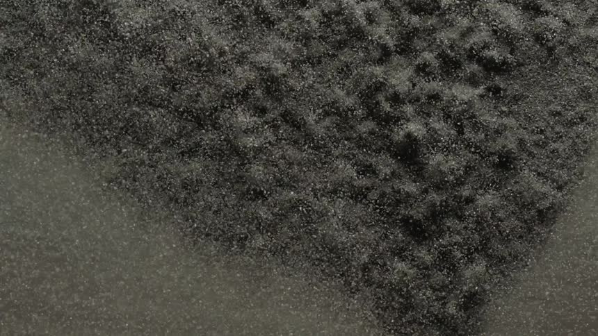 A thin layer of sand is vibrated causing the grains to jump and bounce over each other