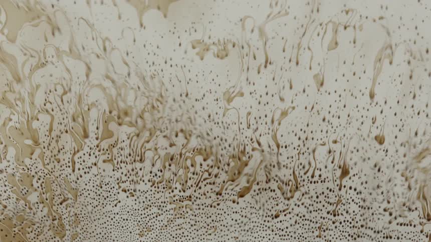 A brown liquid mixing