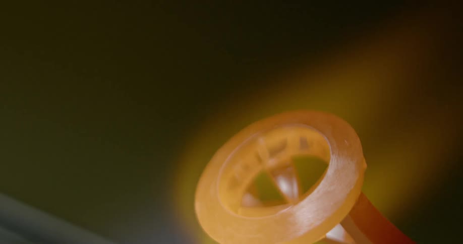 Two metal rings glow orange and red as they are heated with a flame