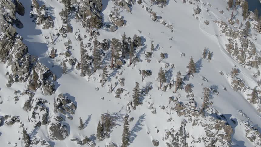 A person skis down a dangerous rocky and steep mountain
