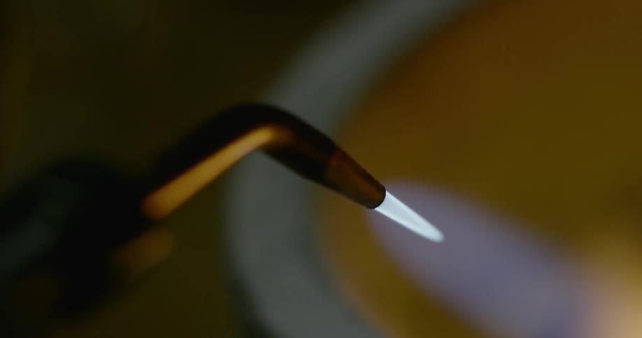 A torch light burning a bowl