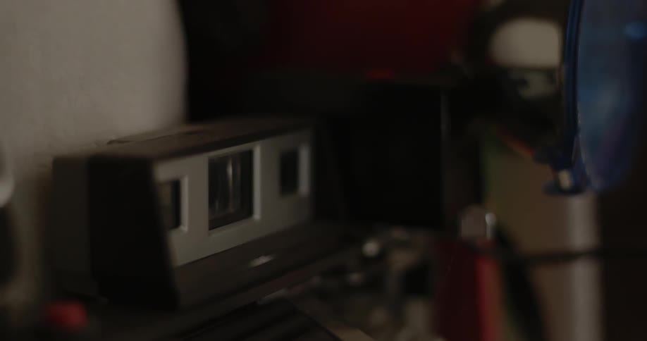 A camera sits on a shelf