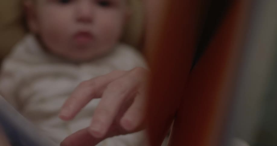 A person reads to a baby