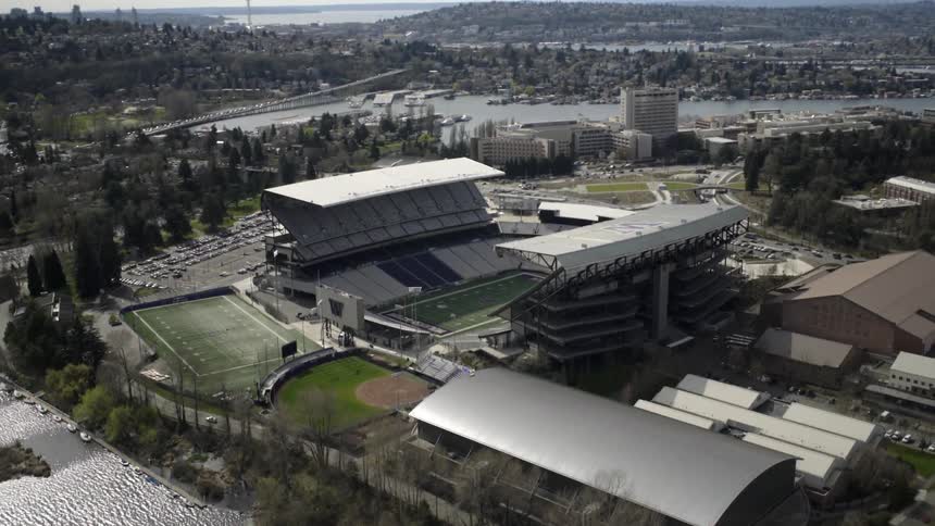 A sports arena and fields sit by the waterfront