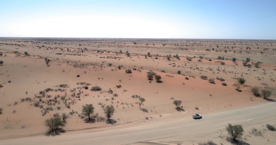A road in the desert with the sky in the background