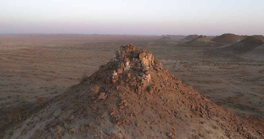 Hills in the desert with the sky in the background