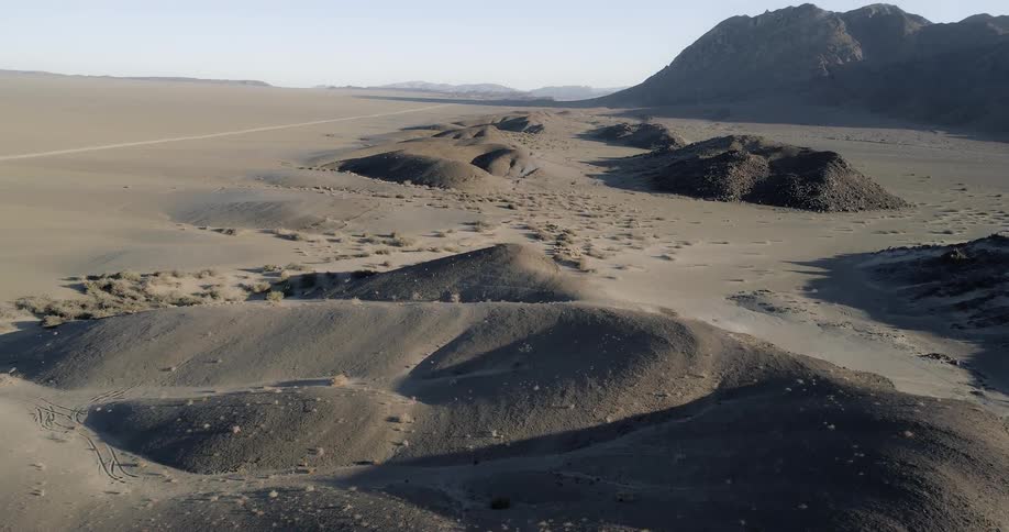 Aerial shot of a desert with dunes