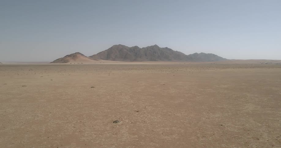 A view of some mountains in a desert