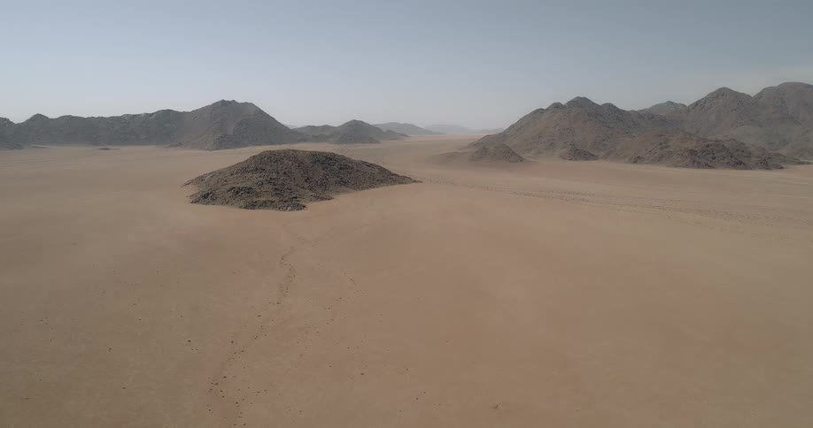 Stone hills dotting a desert